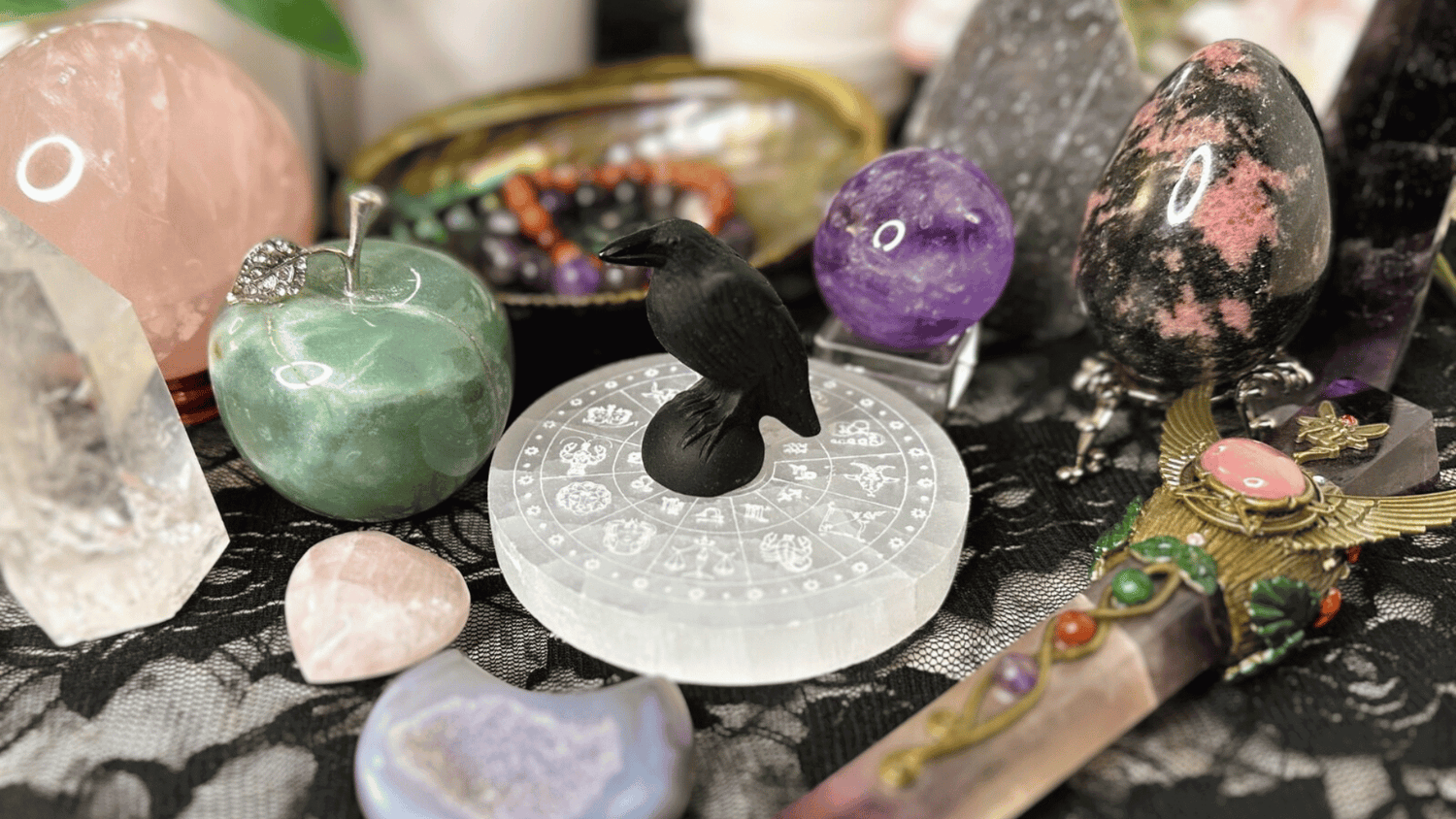 Itsy's Crystal Cove LLC's cover photo showing a variety of natural gemstone carvings and more.